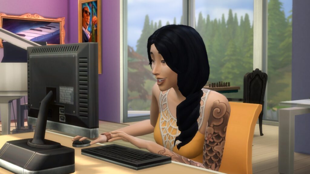Postać z The Sims przed komputerem