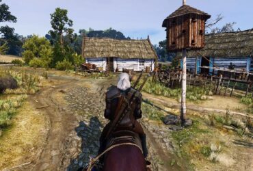 Geralt z Rivii na koniu w małej wsi w grze Wiedźmin 3: Dziki Gon.