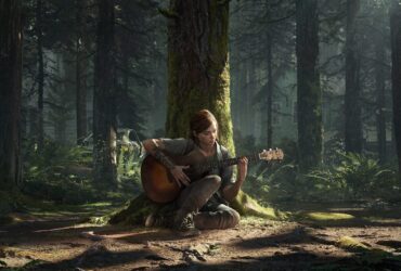 Ellie grająca na gitarze w lesie oparta o drzewo w The Last of Us Part 2