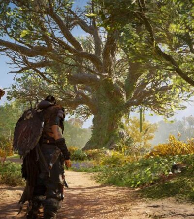 Eivor stojący przed dużym rozłożystym drzewem w Assassin's Creed Valhalla