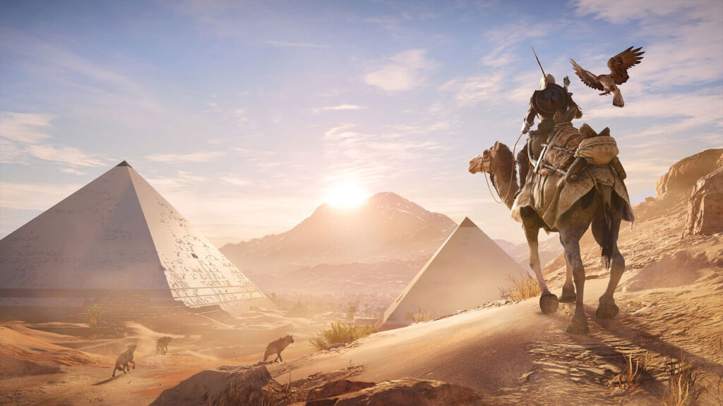 Bayek podróżujący przez pustynię na wielbłądzie w Assassin's Creed: Origins