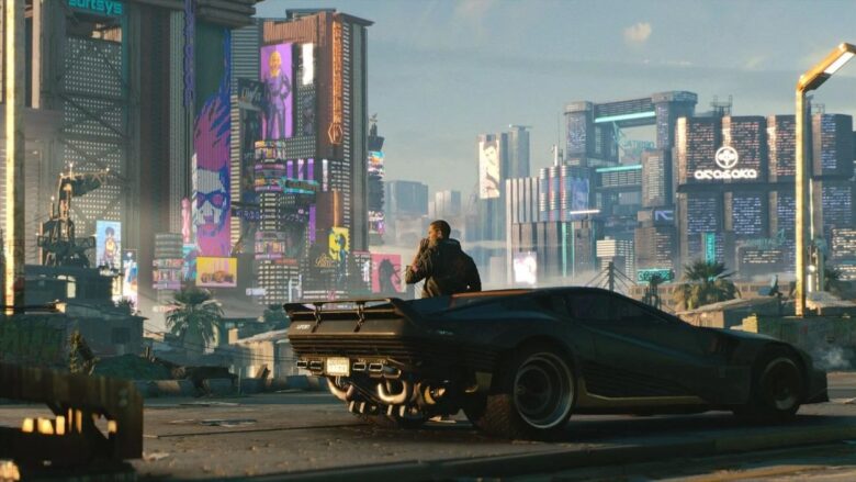 Vi opierający się o samochód przed miastem Night City w Cyberpunk 2077