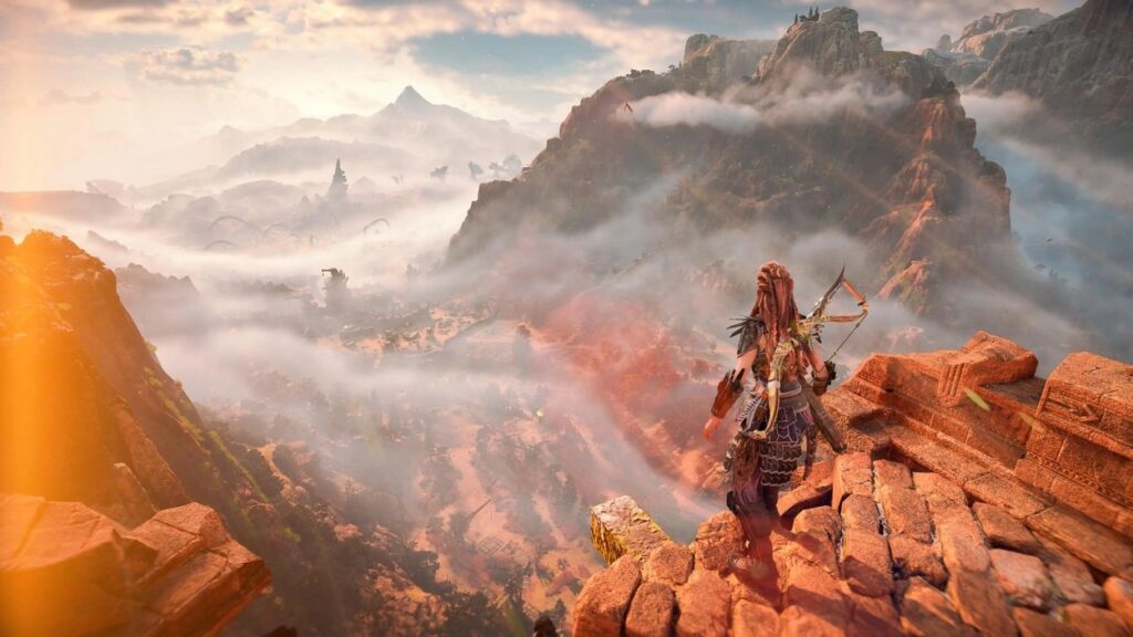 Aloy stojąca nad pustynnym wąwozem w Horizon Forbidden West