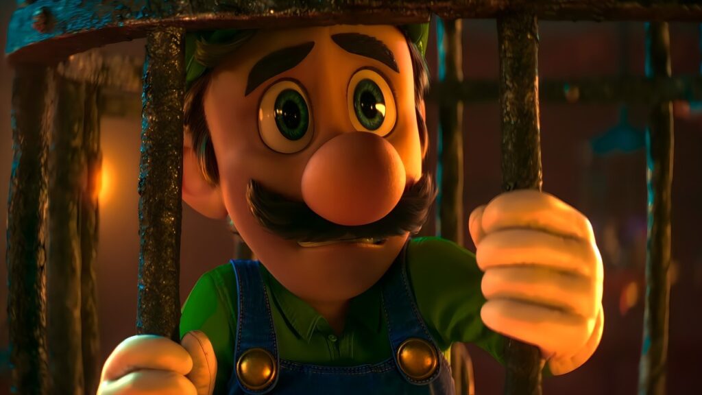 Luigi siedzący w metalowej klatce w filmie The Super Mario Bros. Movie