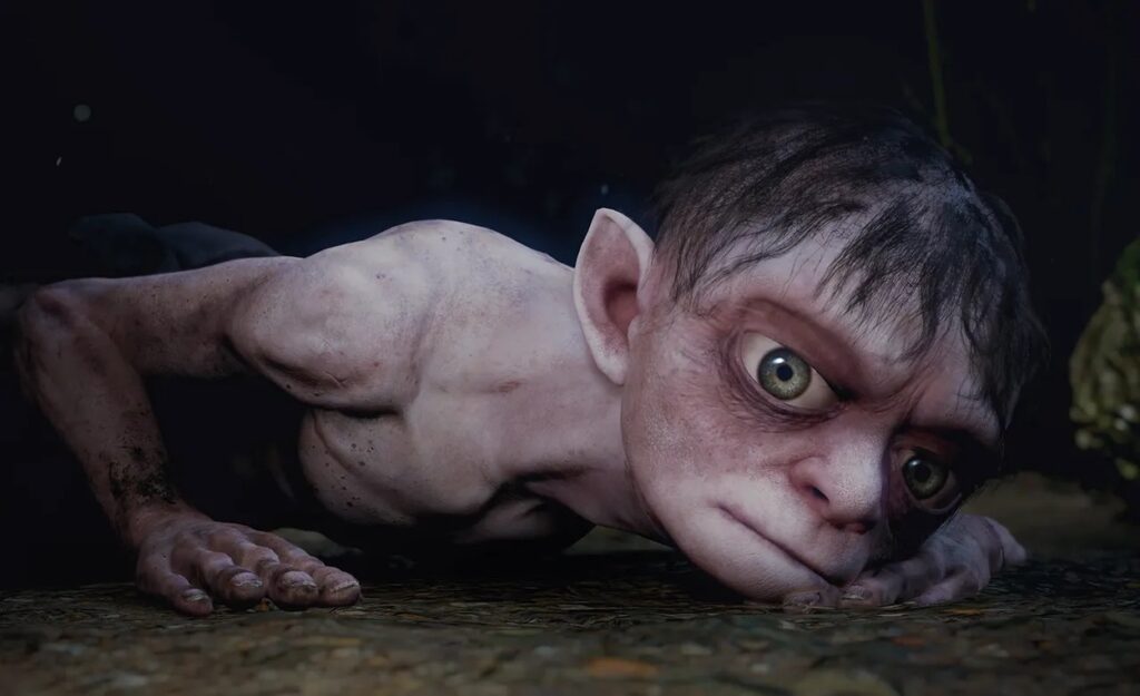 Gollum leżący na ziemi w jaskini w grze The Lord of the Rings: Gollum
