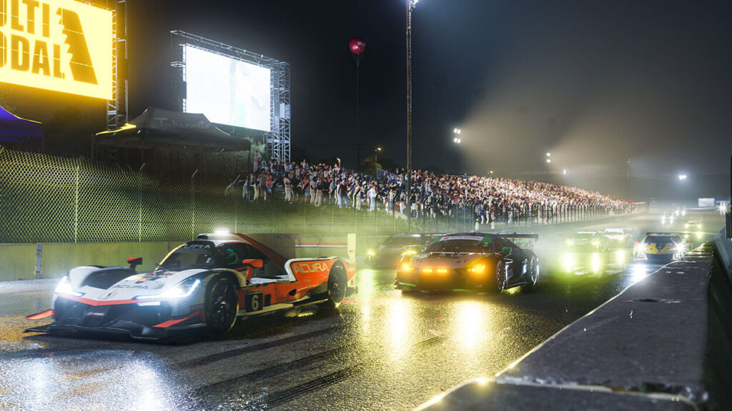 Sportowe samochody w deszczową noc na torze wyścigowym w grze Forza Motorsport