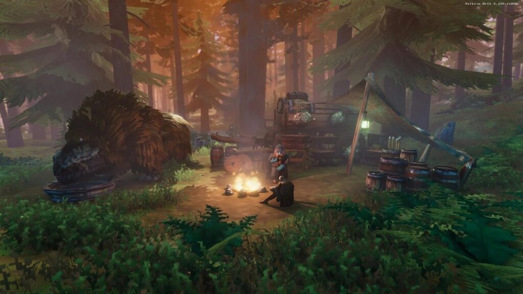 Dwóch bohaterów z Valheim przy ognisku w małym leśnym obozowisku