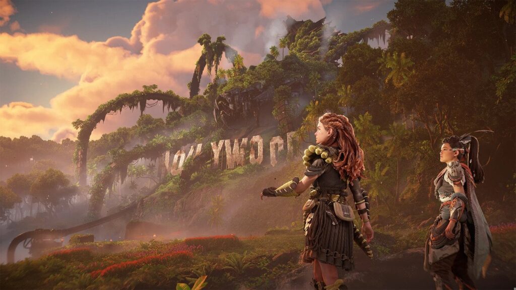 Aloy z inną bohaterką niedaleko napisu Hollywood w Horizon Forbidden West