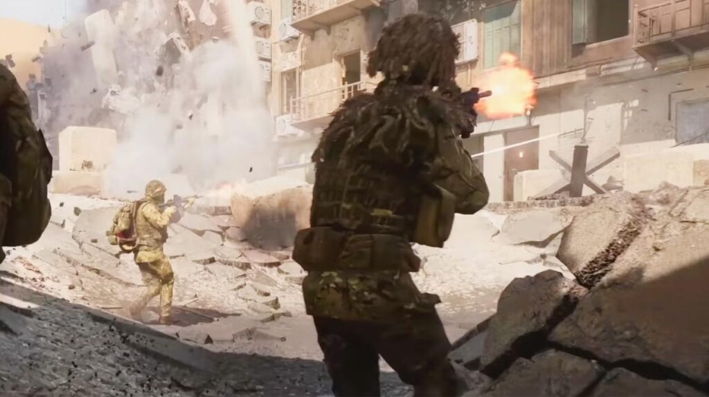 Żołnierze strzelający do budynku na pustynnej mapie w Battlefield 6
