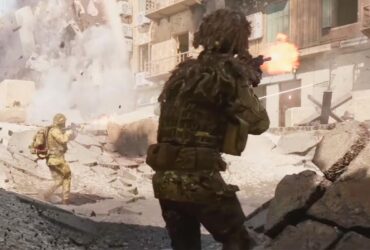 Żołnierze strzelający do budynku na pustynnej mapie w Battlefield 6
