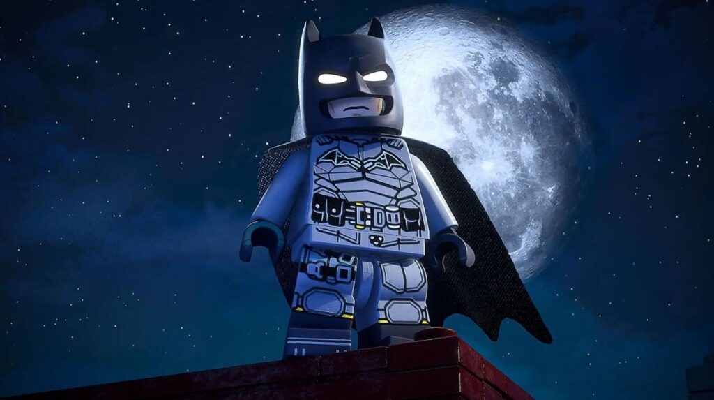 Batman z klocków LEGO stoi na budynku na tle księżyca
