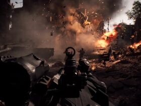Gracz strzela z karabinu maszynowego do przeciwników na tle wybuchającego budynku w Battlefield 6